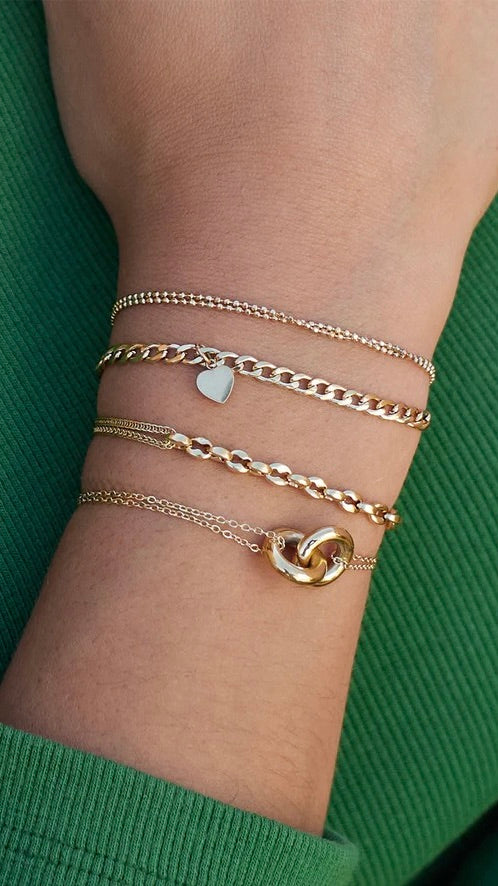 BRACELET 2 ANNEAUX L'UN A L4AUTRE DORE  ZAG MENTI 